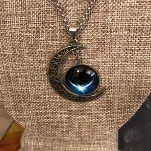 Half moon necklace, silver tone with blue moon charm.